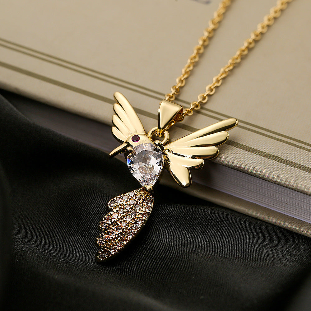 Collana con ciondolo a forma di uccello minimalista in rame placcato oro con zirconi per donna