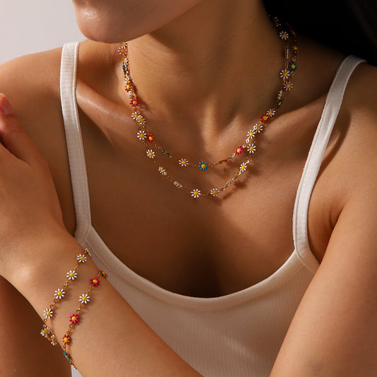 Set collana con ciondolo a margherita minimalista e bracciale in acciaio inossidabile con finitura smaltata da donna