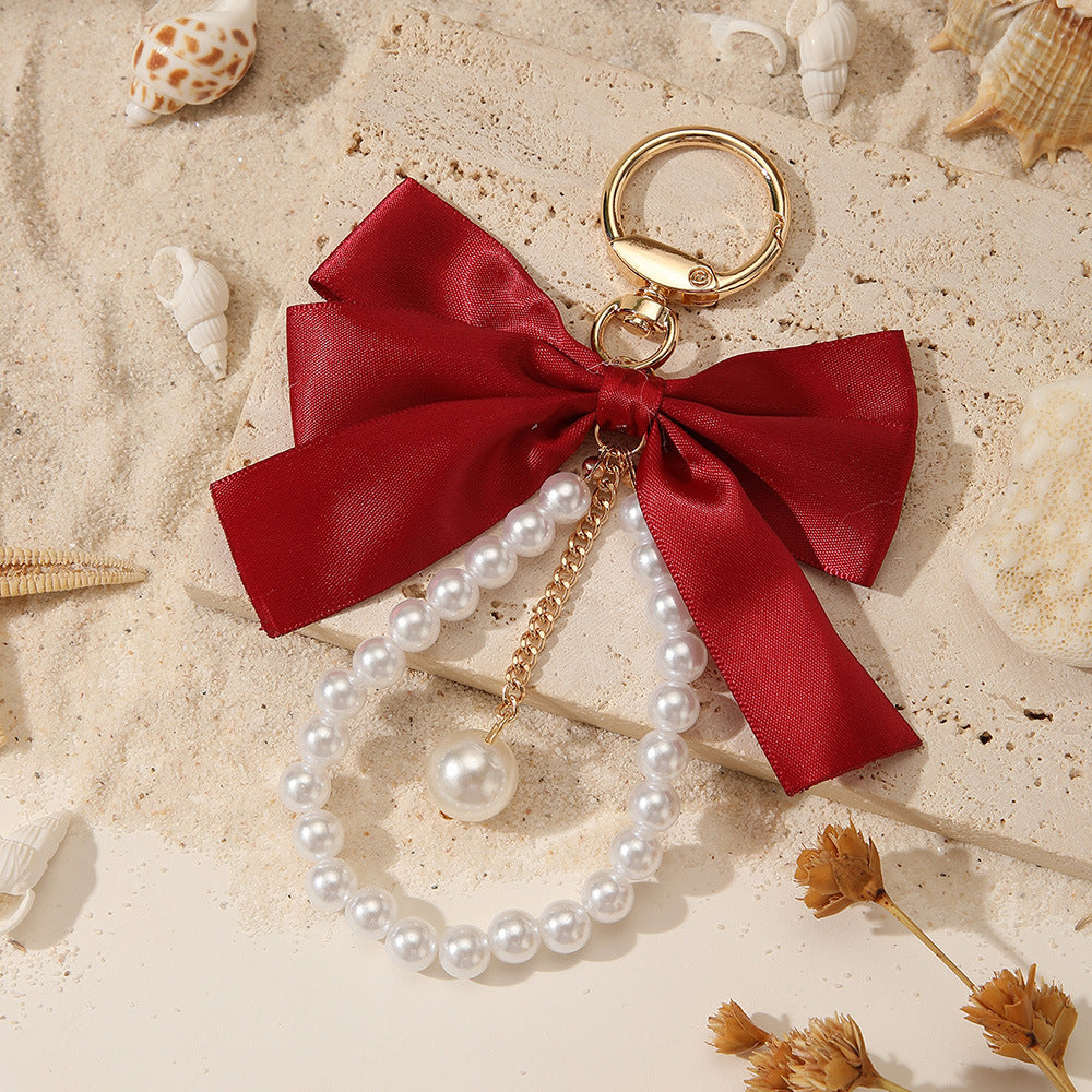 Sweet Cartoon Bow Pearl Zinc Alloy Keychain Bag Charm