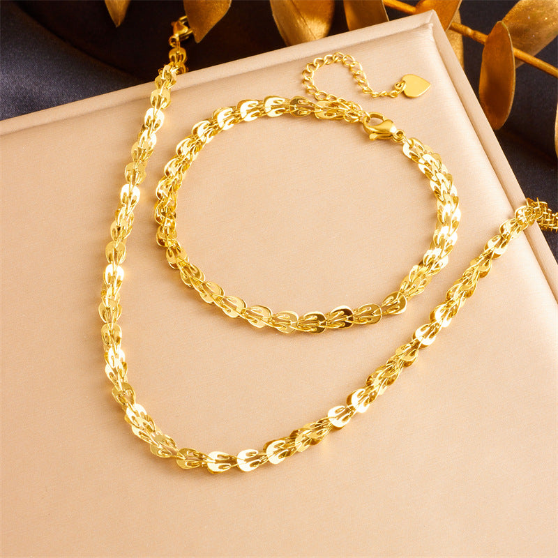 Set bracciale e collana a catena a maglie in acciaio inossidabile placcato con piuma, stile minimalista