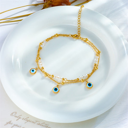 Cavigliera da donna Minimalista con ciondolo a occhio turco blu e perline in acciaio al titanio con design geometrico