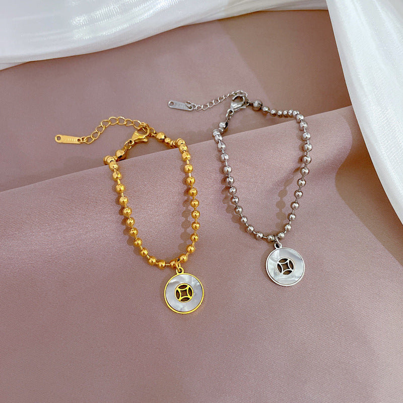 Pulsera redonda con diseño de conchas y cuentas estilo vintage para mujer, hecha de acero de titanio con acabado chapado