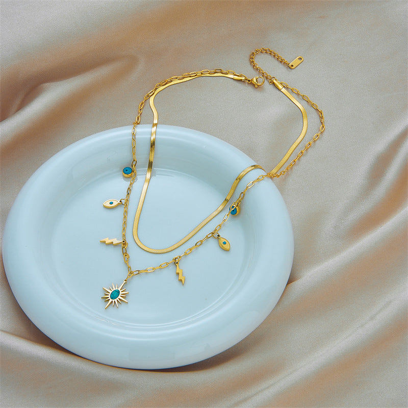 Collana con pendente a fulmine retrò minimalista turchese a forma di occhio in acciaio al titanio con finitura placcata per donna