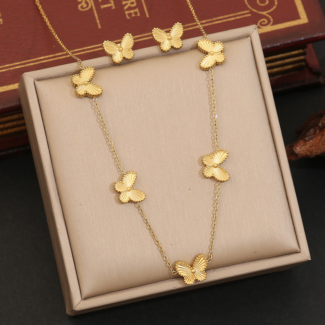 Playful Animal Style Butterfly Pendant Stainless Steel Necklace with Plated Finish for Women