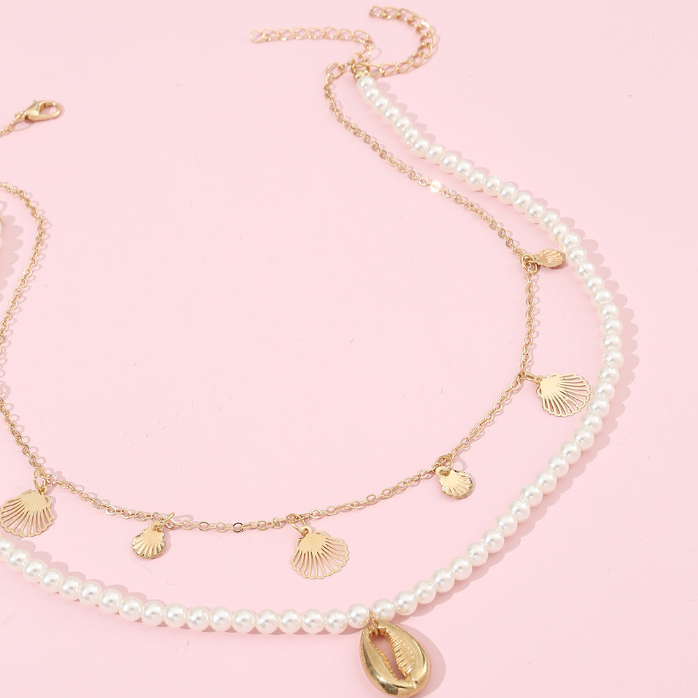 Set di collana con ciondolo a forma di conchiglia minimalista in lega per ragazze con catena di perle e finitura artigianale