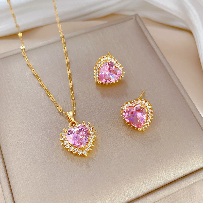 Parure di collana e orecchini a cuore geometrici in acciaio al titanio di lusso