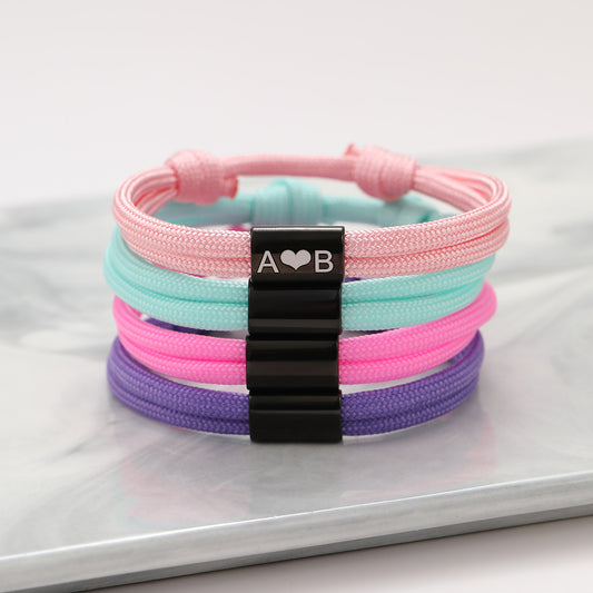 Elegante pulsera trenzada ajustable de acero inoxidable grabada con motivos de corazón y girasol para mujer