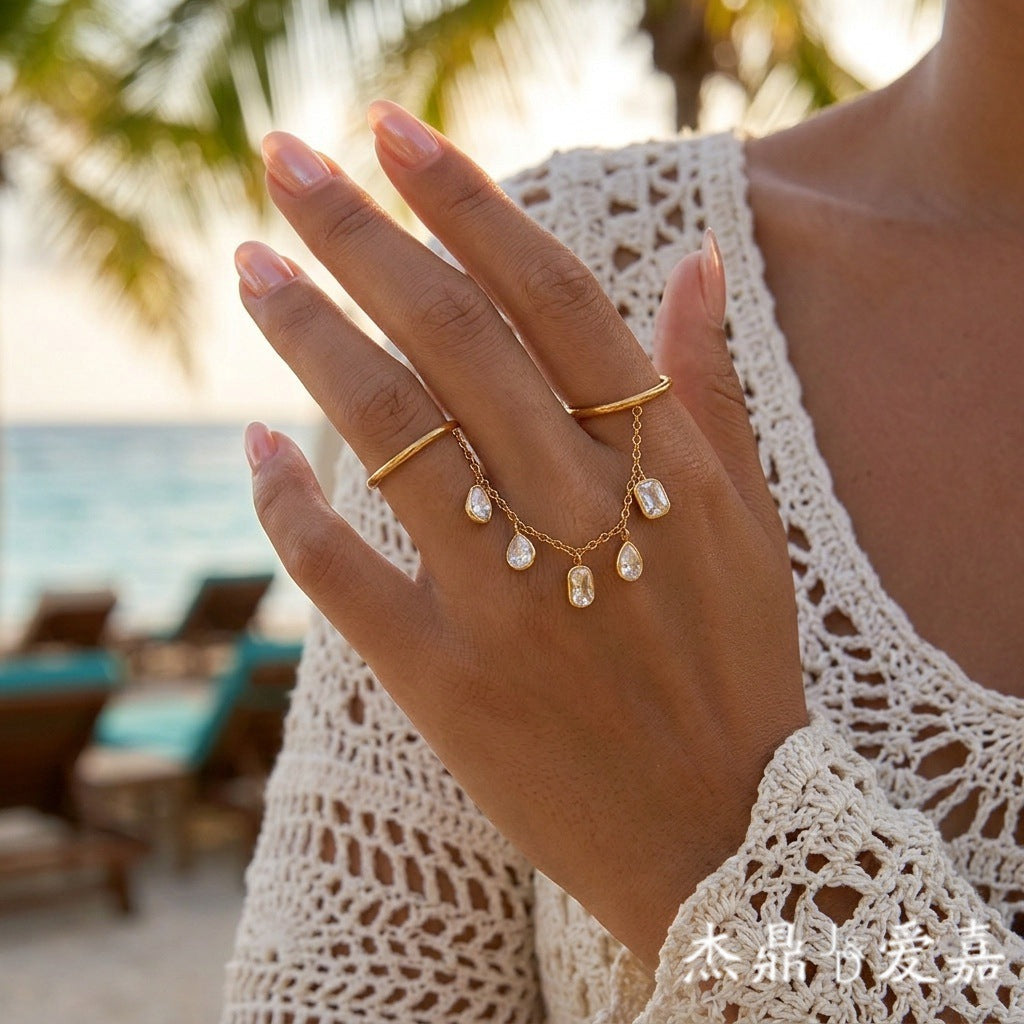 Elegant Geometric Stainless Steel Ring with Cubic Zirconia and Tassel Detail PVD Gold Plated