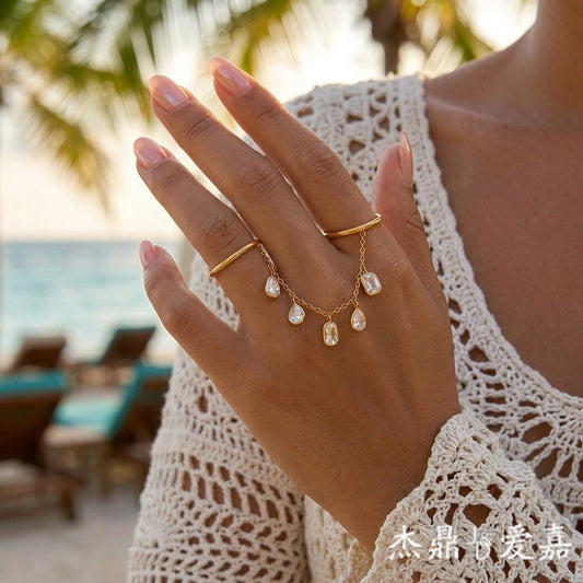 Elegant Geometric Stainless Steel Ring with Cubic Zirconia and Tassel Detail PVD Gold Plated
