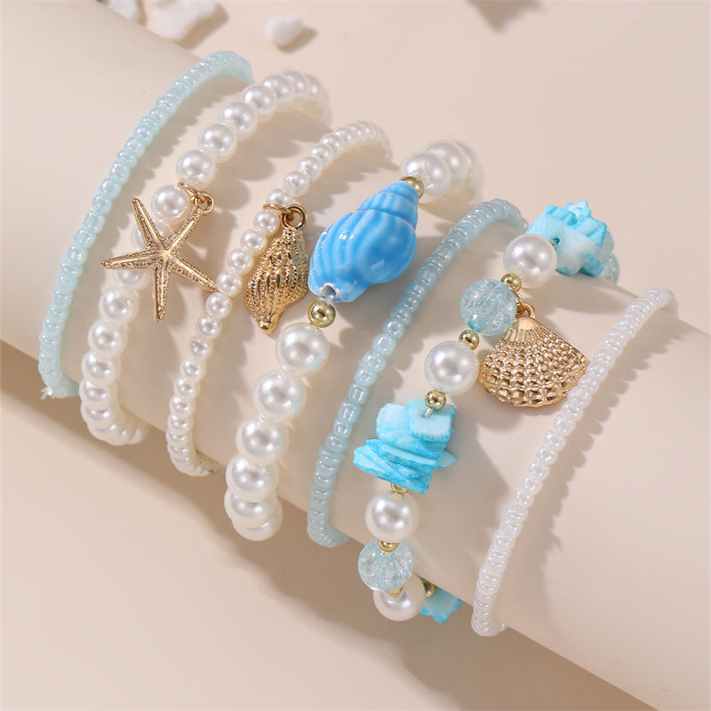 Pulsera de cristal con forma de estrella de mar, minimalista, para niñas, con acabado artesanal y diseño inspirado en el océano.