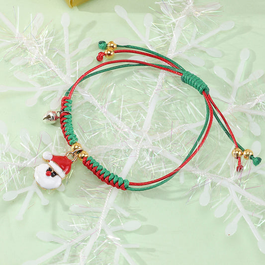 Bracciale Natalizio Artigianale Regolabile da Bambina con Ciondolo Babbo Natale in Cordino di Poliestere Rosso e Verde, Gioiello Festivo