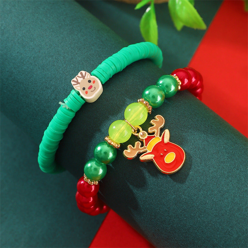 Set di bracciali natalizi fatti a mano in argilla polimerica da donna con ciondoli di Babbo Natale e fiocchi di neve in stile cartone animato giocoso