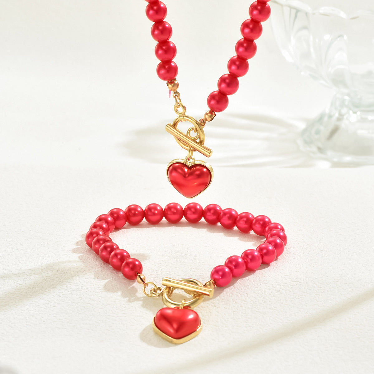 Juego de collar y pulsera minimalistas de aleación en forma de corazón con incrustaciones de perlas para mujer