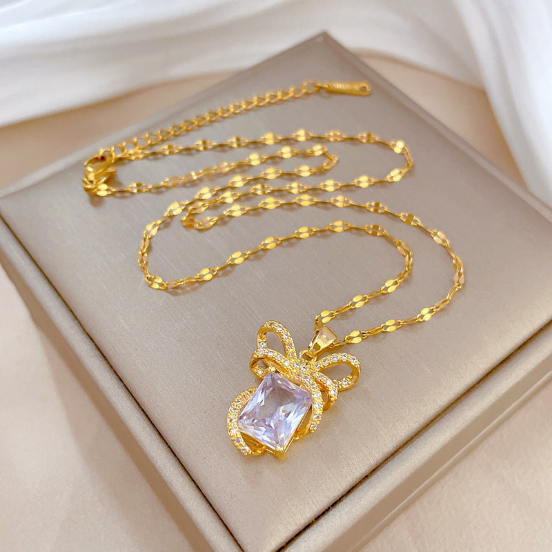 Collar de lujo con colgante de lazo para mujer en acero de titanio con incrustaciones de diamantes de imitación, forma geométrica, acabado chapado, cadena de clavícula