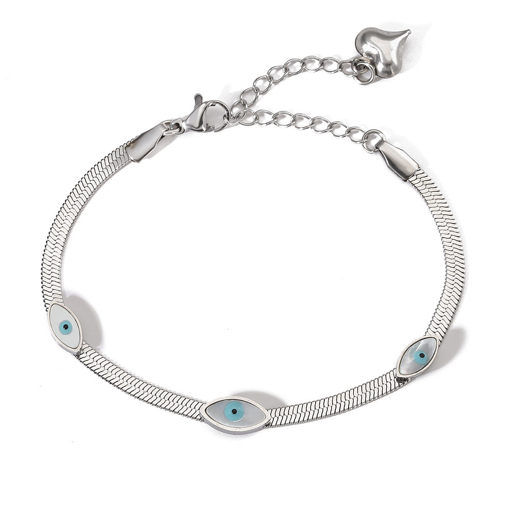 Bracciale minimalista a occhio di Allah in acciaio al titanio con pavé per donna