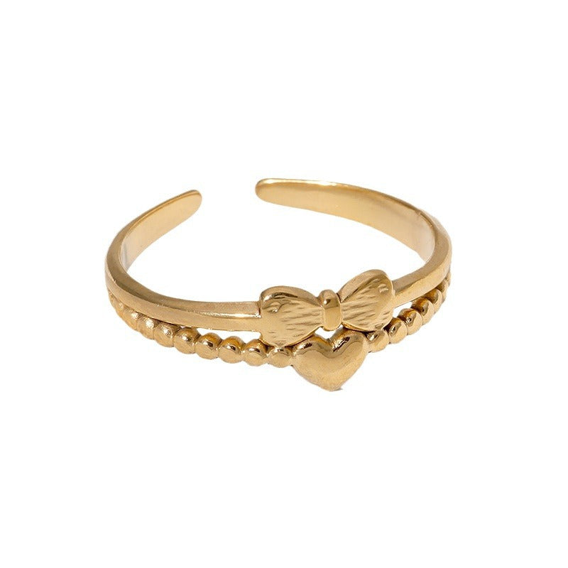 Anello regolabile da donna in acciaio inossidabile con fiocco a forma di cuore minimalista e finitura placcata