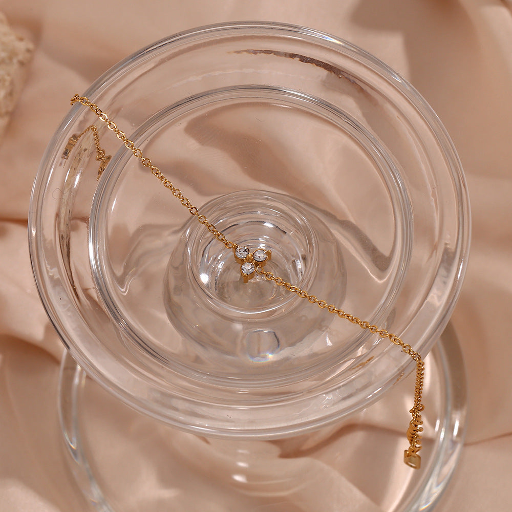 Elegante bracciale da donna placcato oro 18K in acciaio al titanio con strass a forma di fiore di loto