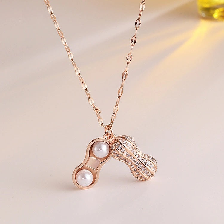 Collar con colgante minimalista de acero de titanio con forma de cacahuete y circonitas para mujer