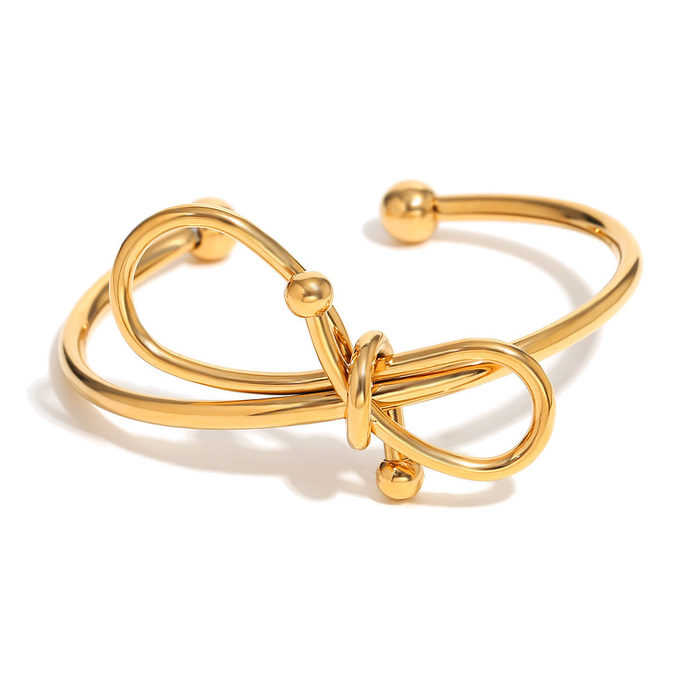Bracciale da donna in acciaio inossidabile placcato oro 18K con fiocco, stile minimalista e alla moda
