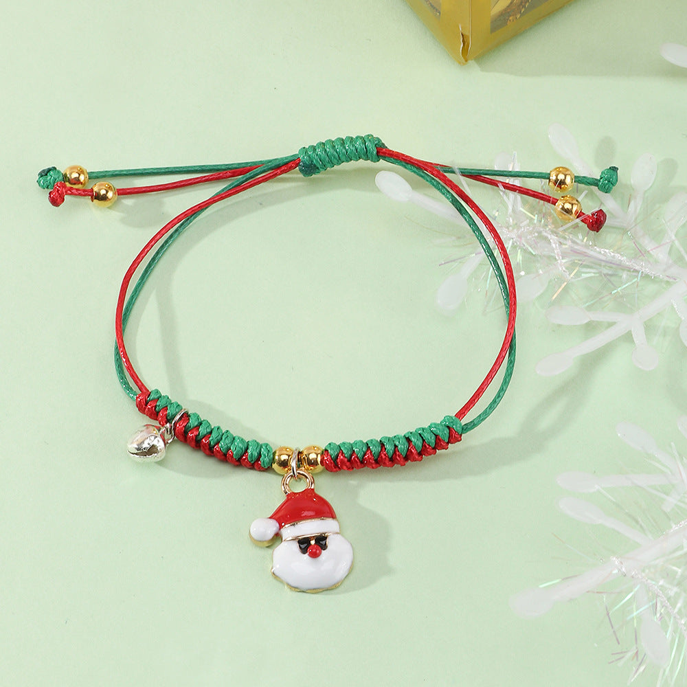 Bracciale Natalizio Artigianale Regolabile da Bambina con Ciondolo Babbo Natale in Cordino di Poliestere Rosso e Verde, Gioiello Festivo