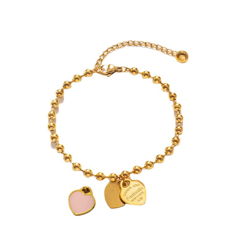 Bracciale minimalista da donna in acciaio al titanio a forma di cuore con finitura placcata