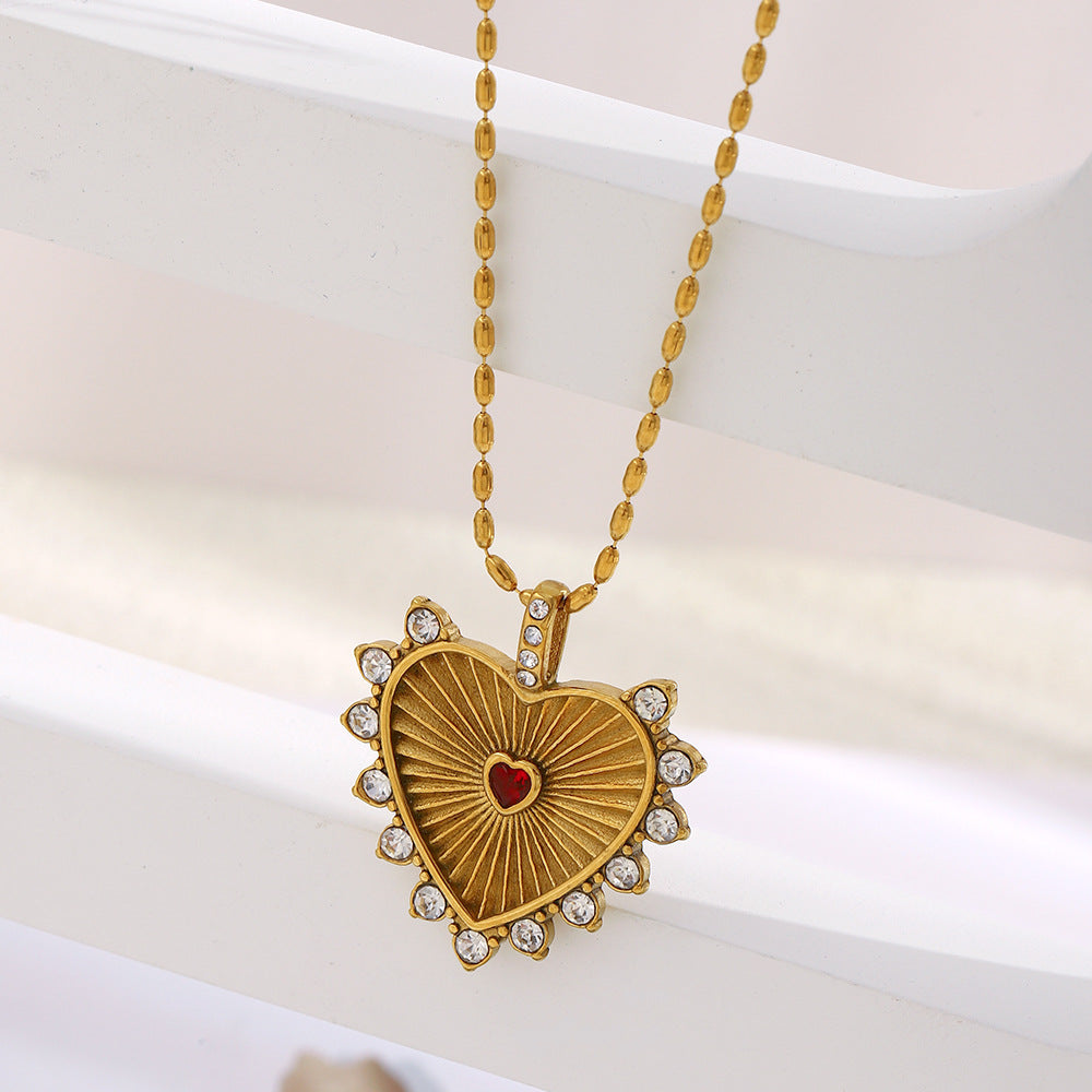 Collar con colgante minimalista de acero inoxidable en forma de corazón para mujer con baño de oro de 18K y elegante grabado