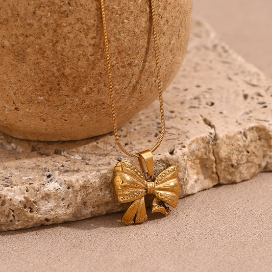 Fashionable Bowknot Pendant Necklace for Women in Stainless Steel with 18K Gold Plating on Delicate Snake Chain
