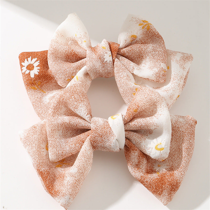 Set de pinzas para el cabello florales pastel dulces para niñas con diseño de tela en forma de moño en estilo ligero de lujo