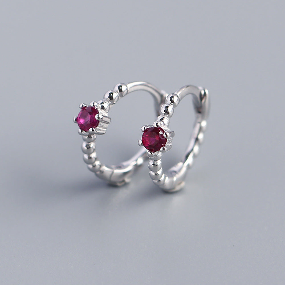 Orecchini a perno tondi con intarsi di diamanti in argento sterling 925