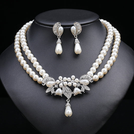 Set di collana e orecchini floreali ispirati a Chanel per donna con lega placcata oro, catena di perline e motivi botanici tra cui grano, petali, foglie e silhouette di alberi