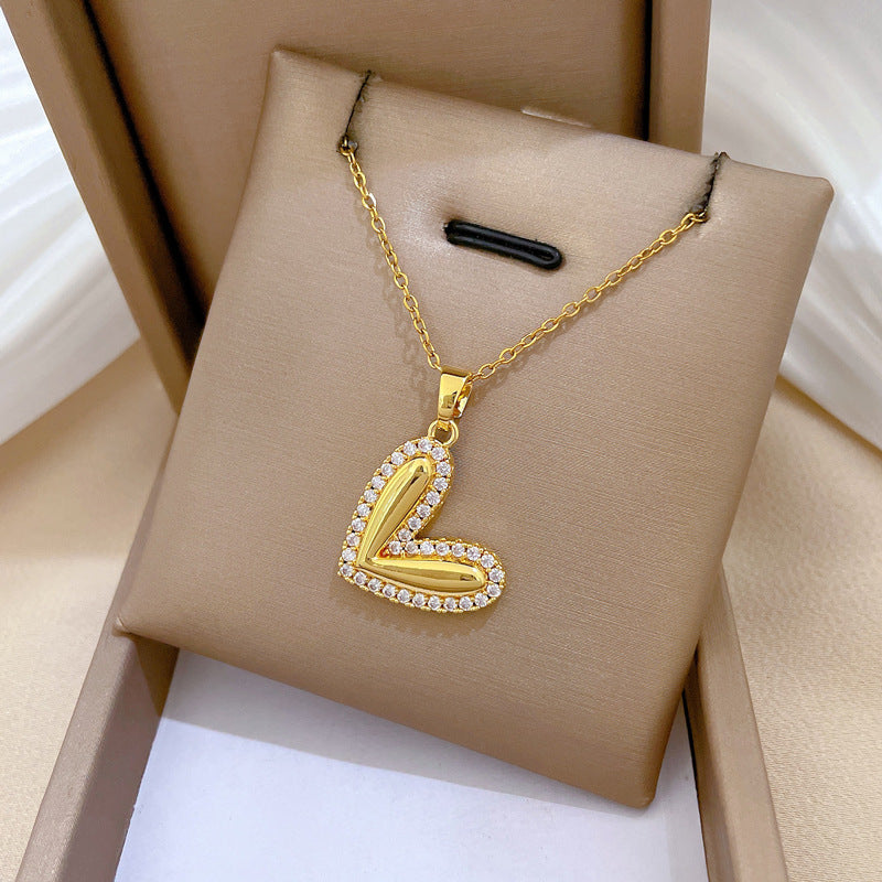 Collana minimalista da donna in acciaio al titanio a forma di cuore, con finitura lucida e intarsio di strass