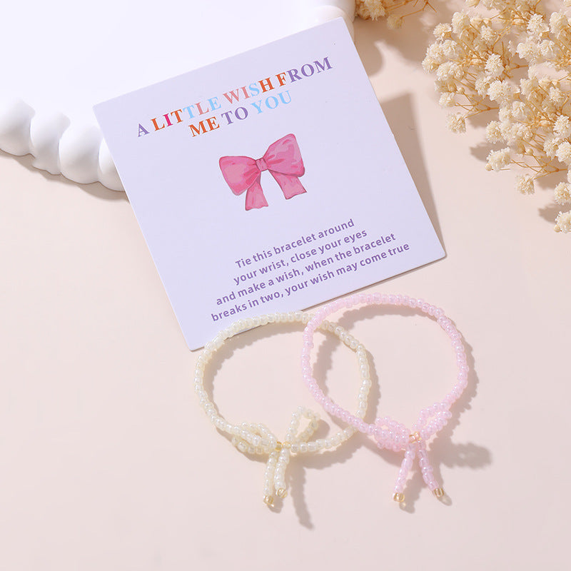 Set di braccialetti per bambini in stile bohémien con fiocco in perle di plastica e resina con accenti di cristallo bianco