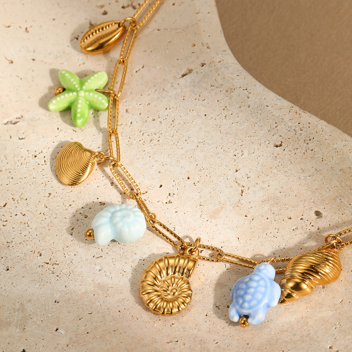 Minimalist Ocean-Inspired Tassel Multi-Pendant Necklace with Starfish and Shell Charms in Stainless Steel with Plated Finish