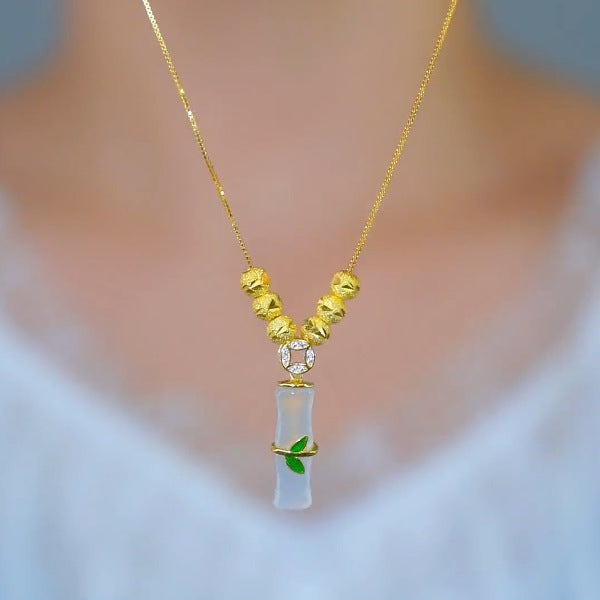 Collar minimalista de acero de titanio con forma de nudo de bambú para mujer con baño de oro y colgante floral irregular