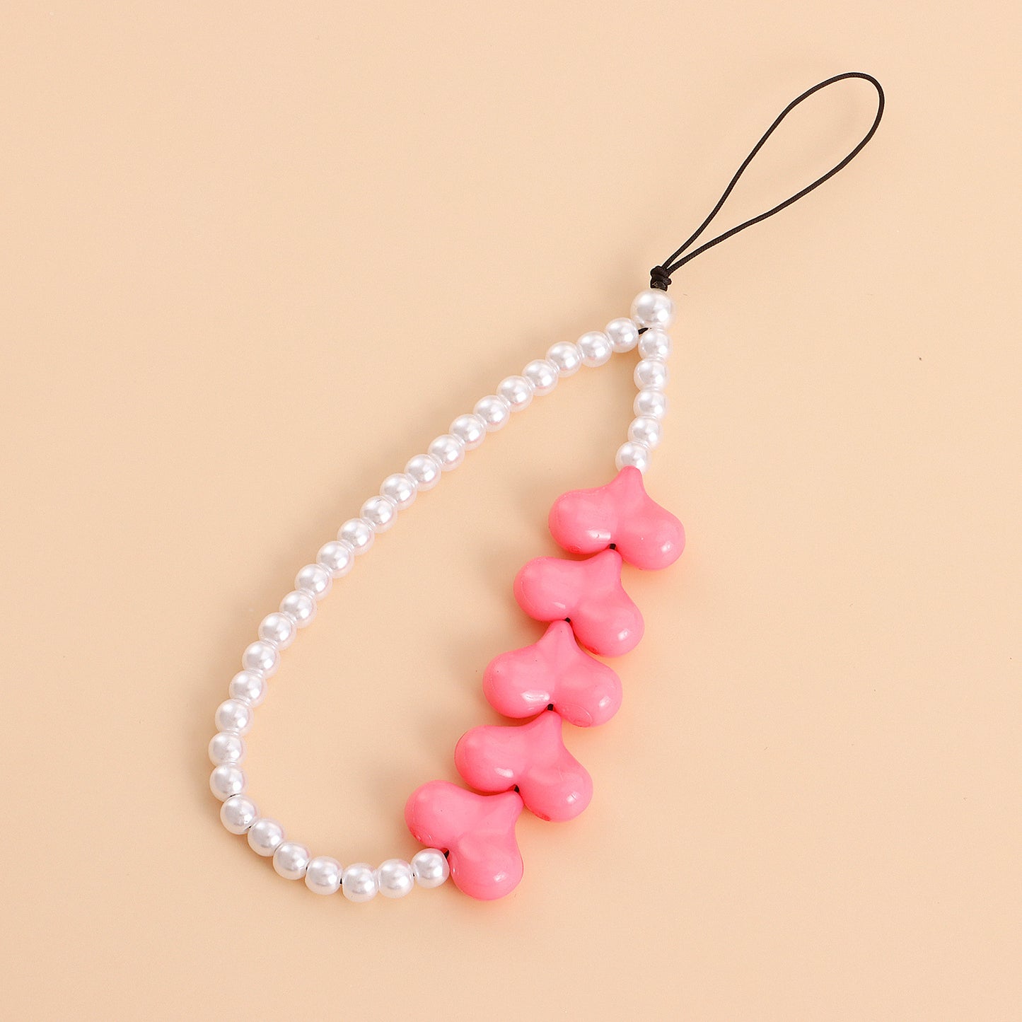 Cordón de teléfono geométrico de acrílico y perlas en forma de corazón con dije de aleación y acabado chapado para mujer