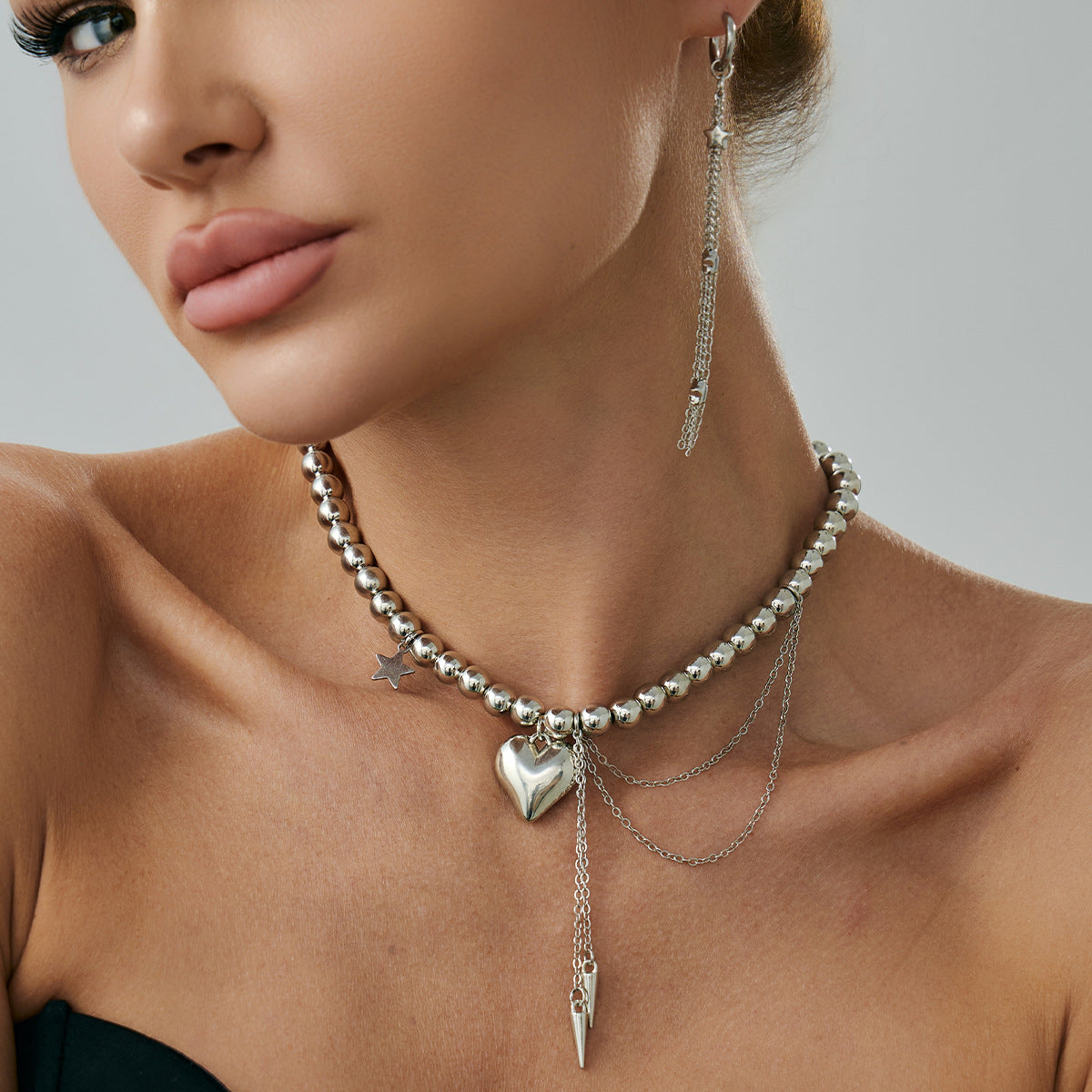 Girocollo con pendente a stella e cuore dolce e audace con nappe da donna