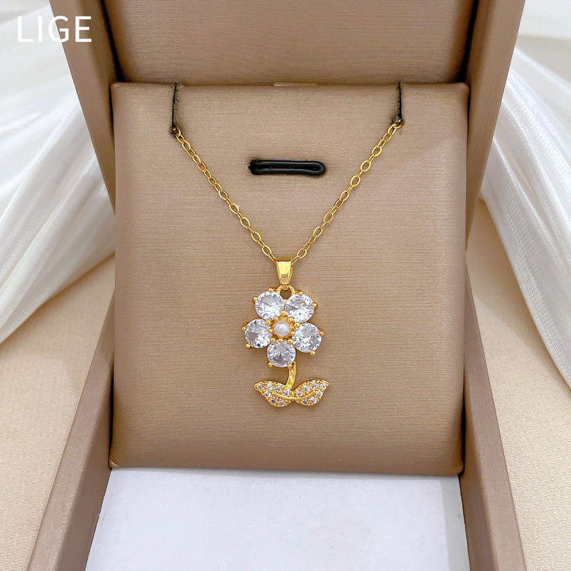 Conjunto de collar y pendientes de lujo de acero titanio con forma geométrica de hojas y flores