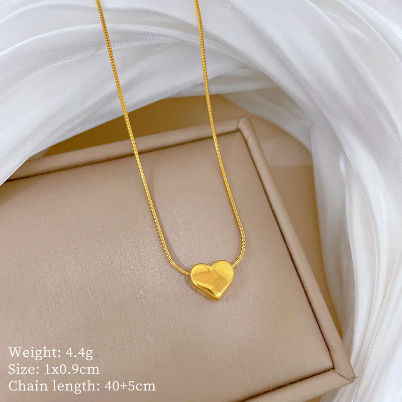 Collana a catena con serpente in acciaio al titanio a forma di cuore minimalista placcata in oro per donne e uomini