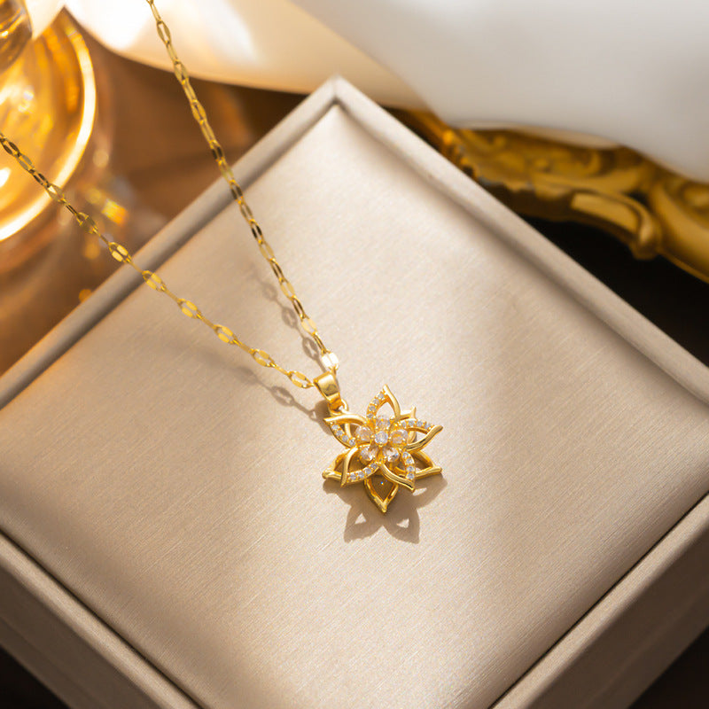 Collana pendente a fiore a cinque petali rotante minimalista da donna in acciaio al titanio con intarsi in strass e catena ondulata