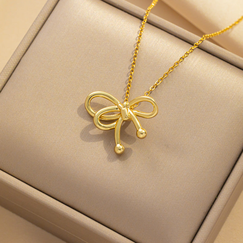 Collana di lusso in acciaio al titanio a forma di fiocco con finitura placcata oro e catena a serpente