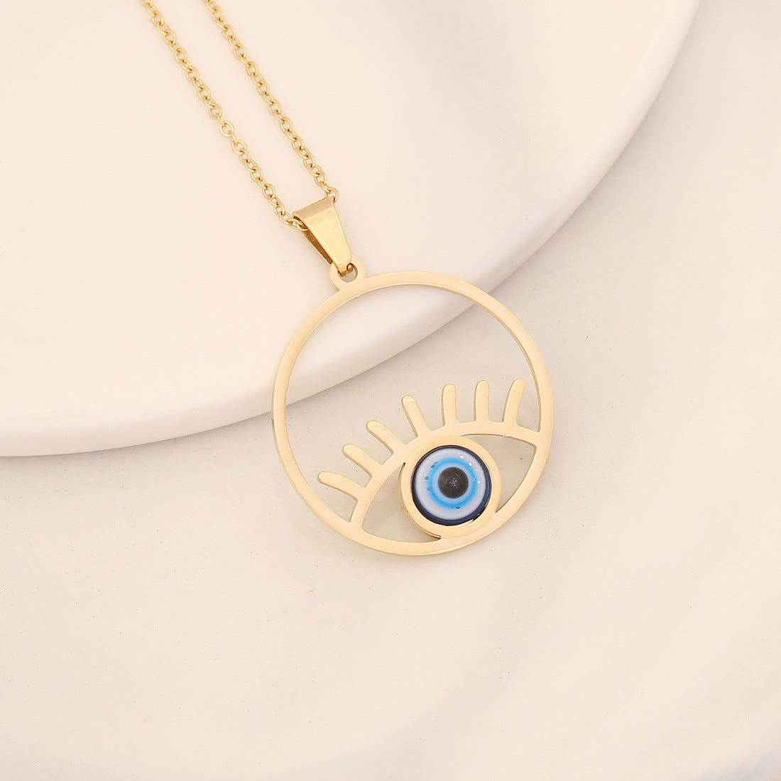 Collana con pendente a forma di occhio in acciaio inossidabile audace con finitura a olio a goccia