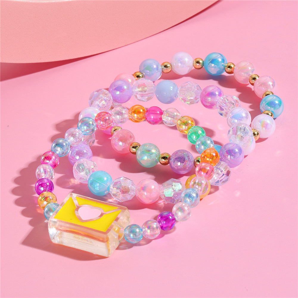 Juego de pulseras de resina con cuentas en forma de corazón estilo caricatura con dijes de cola de sirena y conchas marinas para niños