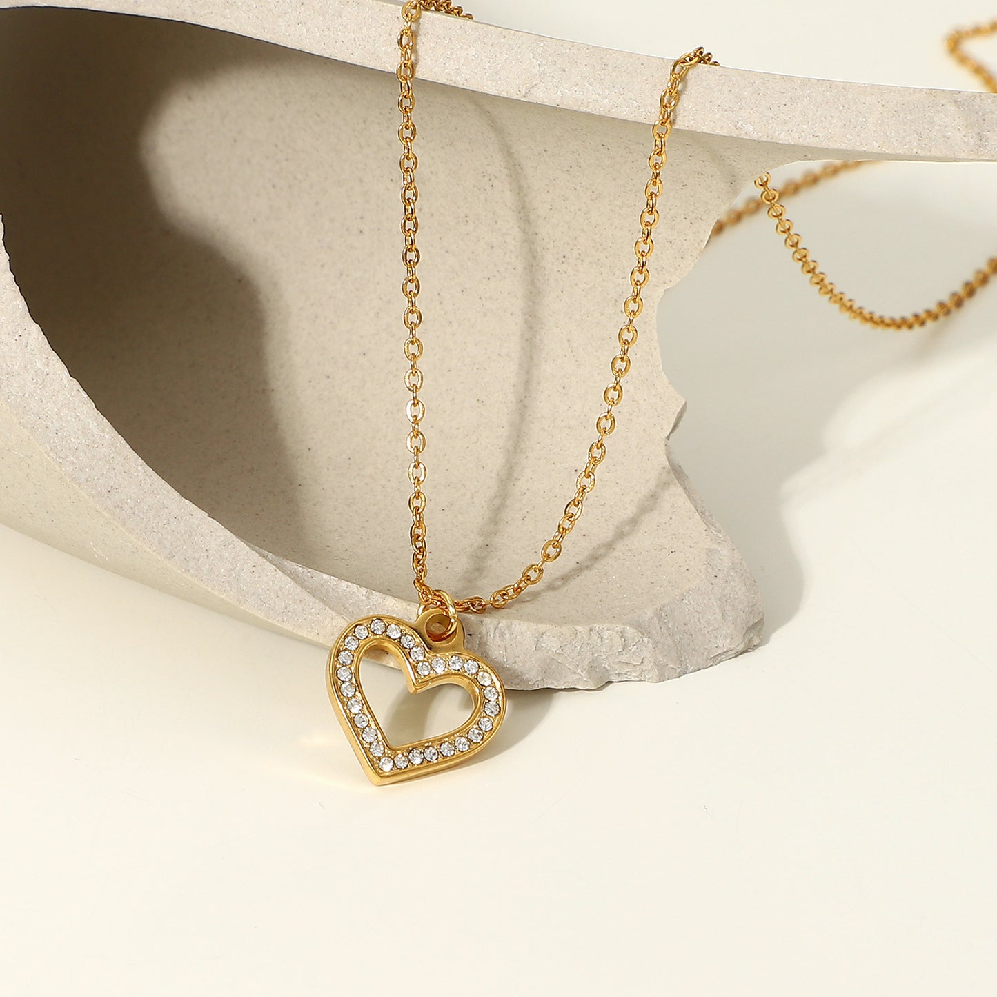 Ins Style Heart Shaped Stainless Steel Necklace with Vacuum Plated 18K Gold Finish and Hollow Design Featuring Clear Zirconia Accents for Women