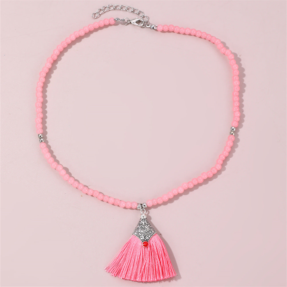 Collana pendente con nappe in stile bohémien per bambini, realizzata in perline di vetro con nappe abbinate su catena di perline rotonde