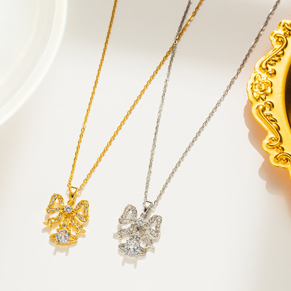 Collana da donna a forma di fiocco minimalista in acciaio al titanio con intarsio di strass, catena a O, delicato gioiello per la clavicola