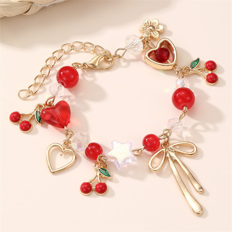 Pulsera con dije de lazo de corazón de cereza dulce para niñas, hecha de resina con detalles artesanales