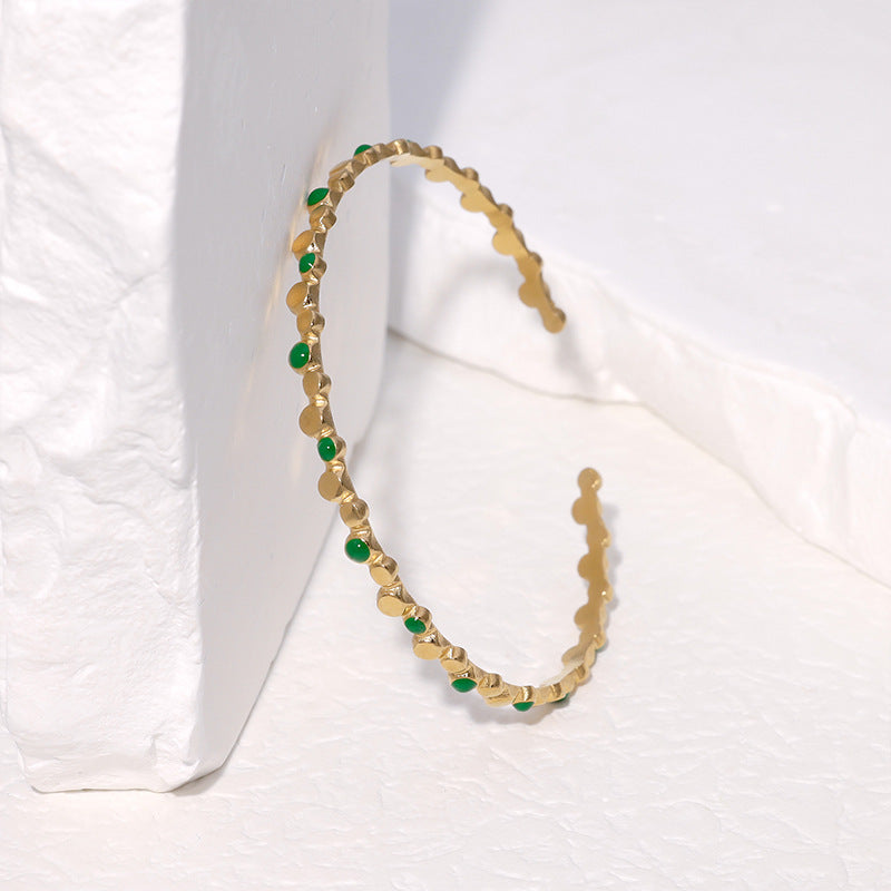 Bracciale rigido aperto in acciaio inossidabile placcato oro 18K con pois geometrici minimalisti alla moda