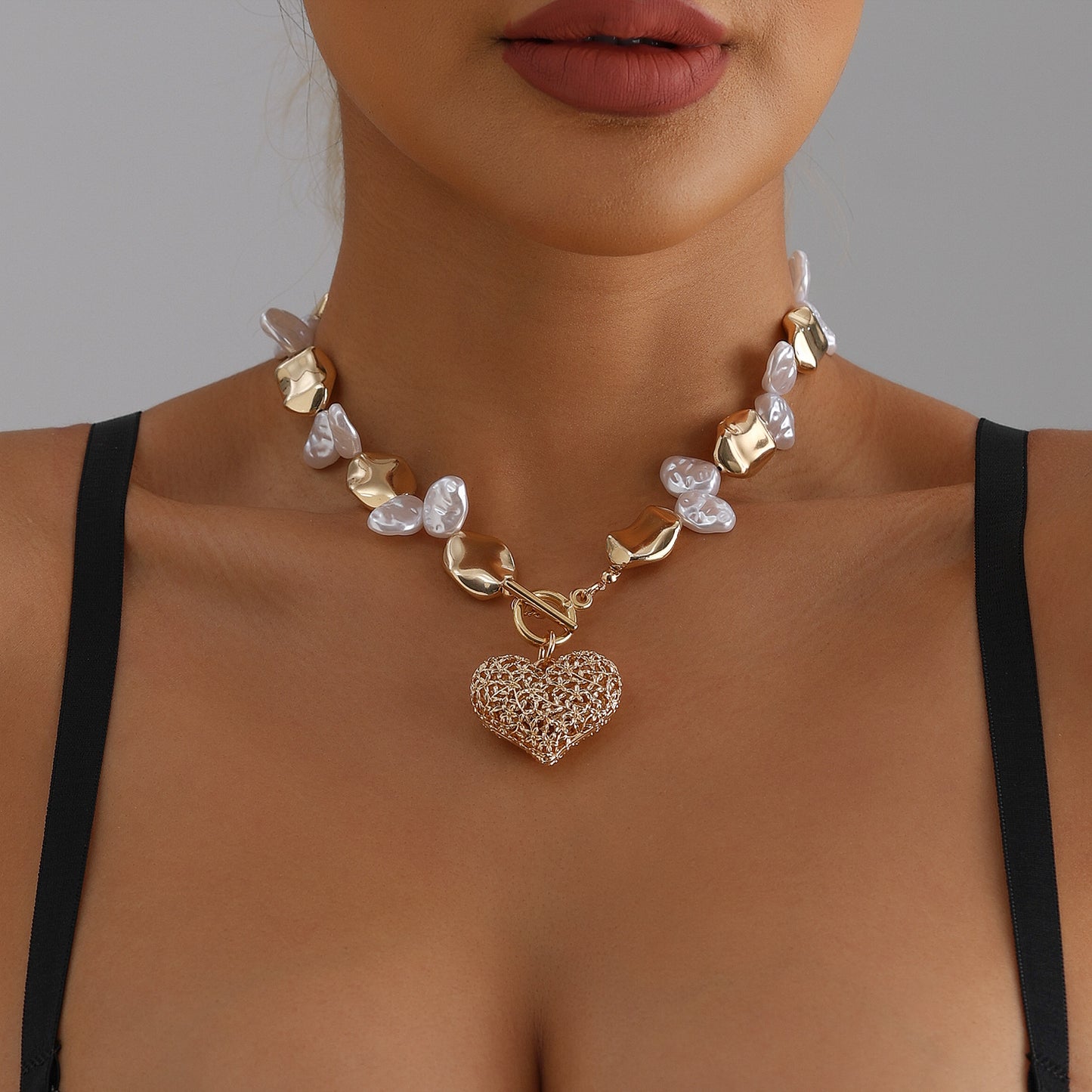 Retro-Inspired Hollow Heart Pendant Necklace for Women with Alloy Chain and Electroplated Finish