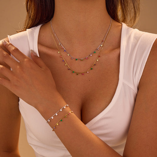 Collana da donna alla moda placcata in acciaio inossidabile con motivo geometrico, ciondolo a zircone colorato e dettagli a frange