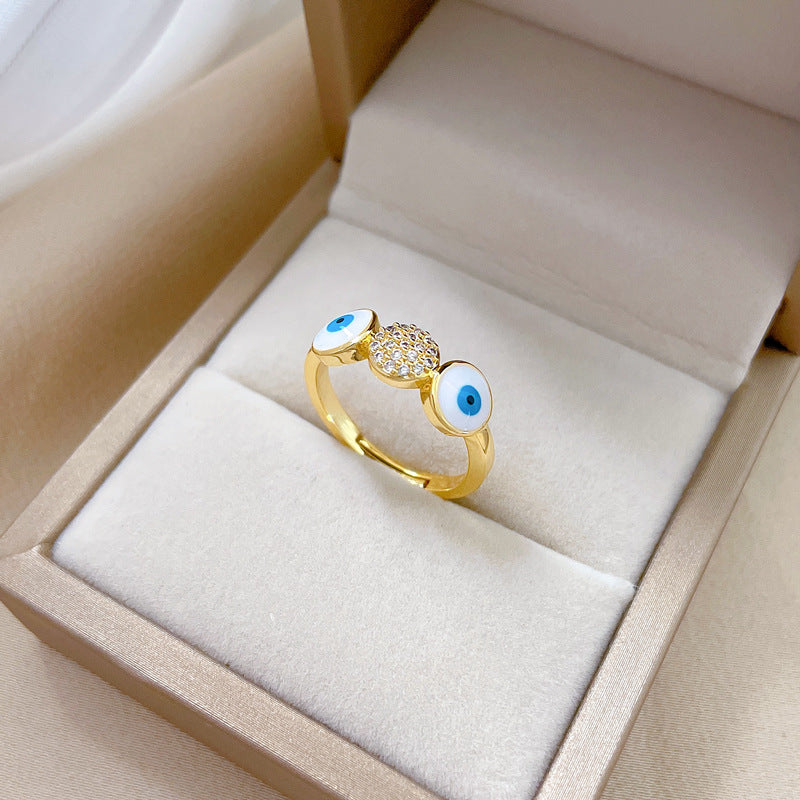 Anello da donna in ottone placcato oro con zirconi micro-incastonati a forma di occhio minimalista